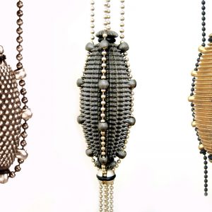 <strong>Art Jewellery by Young Talents 2011</strong><br>»Bille«, »Hérisson« and »Rainure« amulets, oxidised / rhodium-plated / fine gold-plated silver, rubber, Designed using 3D software, manufactured using laser sintering technology, <strong>Till Baacke</strong>, Pforzheim, 2005 <span class="fotocredits">Photo: Till Baacke</span>